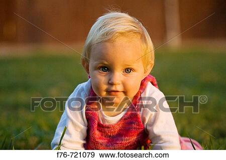 Portrait of a one year old blond baby girl View Large Photo Image Stock Photo - Portrait of a one year old blond baby girl. Fotosearch