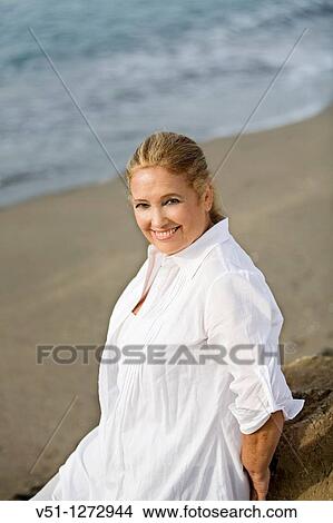 Portrait of a senior adult woman at the beach View Large Photo Image Picture - Portrait of a senior adult woman at the beach. Fotosearch