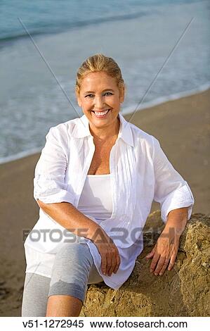 Portrait of a senior adult woman at the beach View Large Photo Image Stock Photography - Portrait of a senior adult woman at the beach. Fotosearch