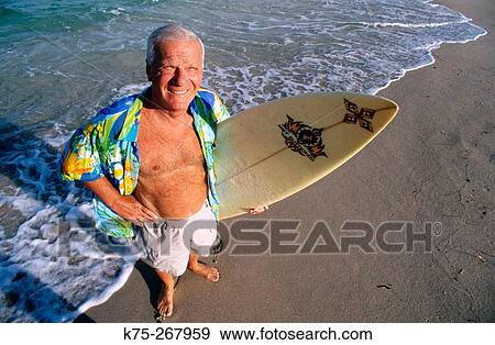 Portrait of a senior surfer View Large Photo Image Stock Photo - Portrait of a senior surfer. Fotosearch