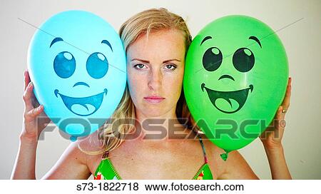 Portrait of a serious young woman with balloons View Large Photo Image Stock Photo - Portrait of a serious young woman with balloons. Fotosearch