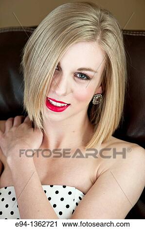 Portrait of a smiling 19 year old blond woman looking directly at camera View Large Photo Image Stock Image - Portrait of a smiling 19 year old blond woman looking directly at camera. Fotosearch