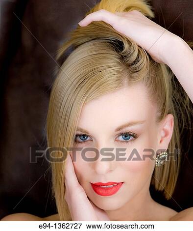 Portrait of a smiling 19 year old blond woman looking directly at camera View Large Photo Image Stock Photo - Portrait of a smiling 19 year old blond woman looking directly at camera. Fotosearch