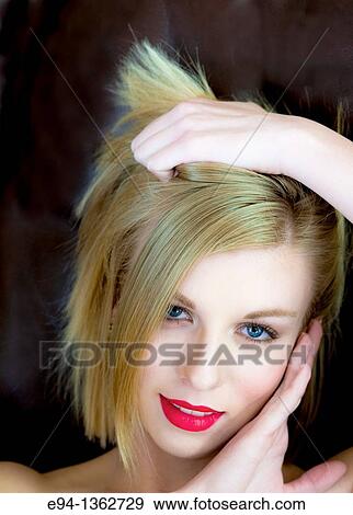 Portrait of a smiling 19 year old blond woman looking directly at camera View Large Photo Image Stock Photo - Portrait of a smiling 19 year old blond woman looking directly at camera. Fotosearch