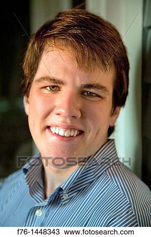 Portrait of a smiling teenage boy View Large Photo Image Stock Image - Portrait of a smiling teenage boy. Fotosearch