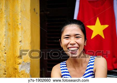 Stock Image - Portrait of a smiling vietnamese woman in Hoi An, Vietnam, South East Asia, Asia. Fotosearch