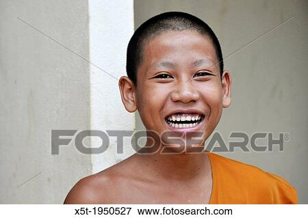 Portrait of a smiling young Buddhist priest in Vang Vieng, Laos. View Large Photo Image Stock Photo - Portrait of a smiling young Buddhist priest in Vang Vieng, Laos.. Fotosearch