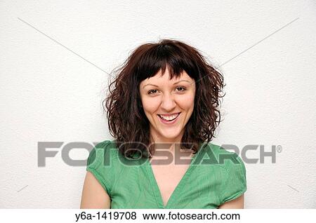 Portrait of a smiling young woman View Large Photo Image Stock Photo - Portrait of a smiling young woman. Fotosearch