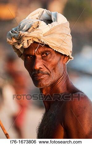Stock Photograph - portrait of a stilt fisherman in Midigama, Sri Lanka. Fotosearch