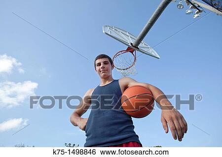Portrait of a teen basketball player View Large Photo Image Stock Photograph - Portrait of a teen basketball player. Fotosearch