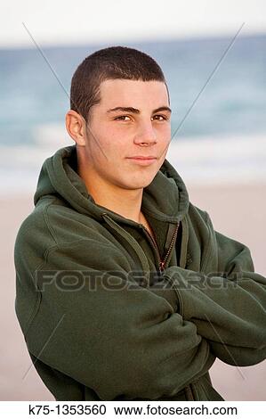 portrait of a teen boy outdoors at the beach View Large Photo Image Stock Image - portrait of a teen boy outdoors at the beach. Fotosearch