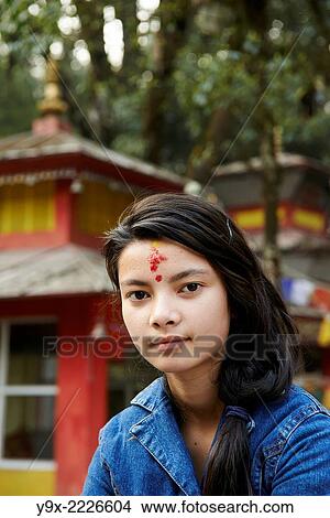 Picture - Portrait of a teenage girl with a Hindu tilaka marking at Tiger Hill.. Fotosearch