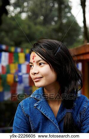 Stock Photography - Portrait of a teenage girl with a Hindu tilaka marking at Tiger Hill.. Fotosearch
