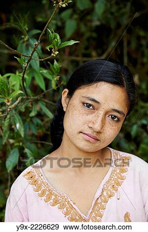 Portrait of a teenage Tibetan female labor worker. View Large Photo Image Stock Photo - Portrait of a teenage Tibetan female labor worker.. Fotosearch
