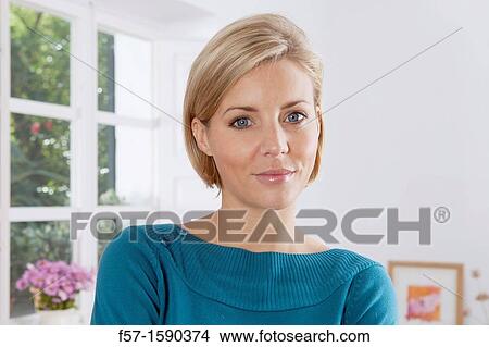 Portrait of a thirty year old woman at home View Large Photo Image Picture - Portrait of a thirty year old woman at home. Fotosearch