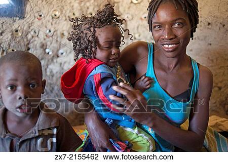 Portrait of a Western mother and daughter wearing her hair in braids at camp Batawana. View Large Photo Image Stock Image - Portrait of a Western mother and daughter wearing her hair in braids at camp Batawana.. Fotosearch