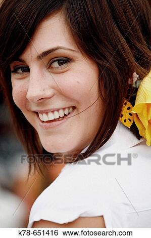 Stock Photograph - Portrait of a woman during the April Fair, Seville, Spain.. Fotosearch