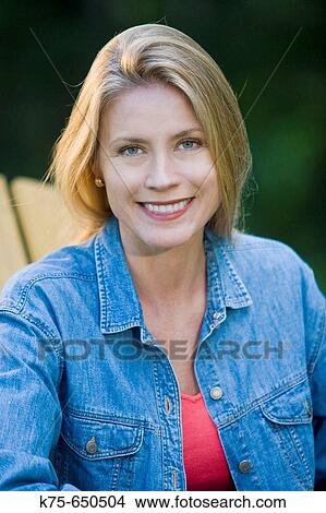 Picture - portrait of a woman outdoors. Fotosearch