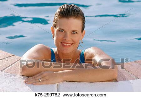 portrait of a woman poolside View Large Photo Image Stock Image - portrait of a woman poolside. Fotosearch