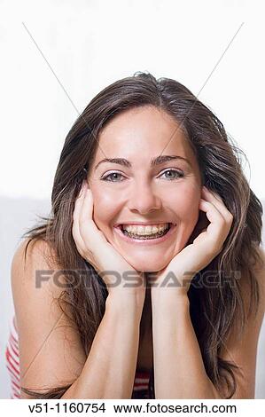 Portrait of a woman smiling with brace View Large Photo Image Picture - Portrait of a woman smiling with brace. Fotosearch