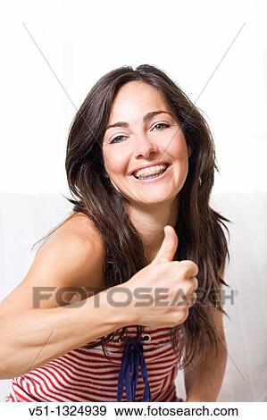 Stock Photo - Portrait of a woman smiling with brace. Fotosearch
