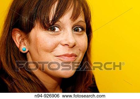 Stock Photograph - Portrait of a woman very attentive. Fotosearch
