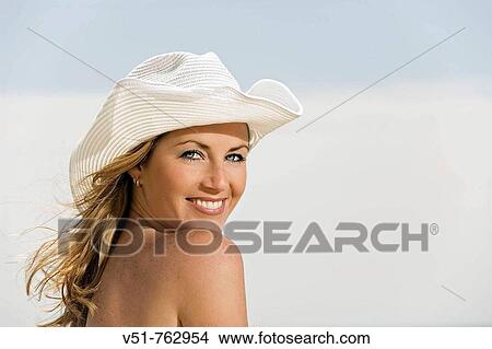 portrait of a woman wearing a hat by the sea View Large Photo Image Picture - portrait of a woman wearing a hat by the sea. Fotosearch