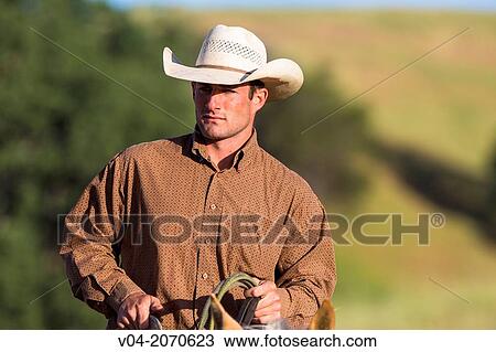 Portrait of a wrangler (cowboy) on horse, California, USA View Large Photo Image Stock Image - Portrait of a wrangler (cowboy) on horse, California, USA. Fotosearch