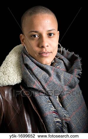 Portrait of a young, African immigrant to The Netherlands. This attractive woman has a caucasian Dutch father and a black African mother. View Large Photo Image Stock Image - Portrait of a young, African immigrant to The Netherlands. This attractive woman has a caucasian Dutch father and a black African mother.. Fotosearch