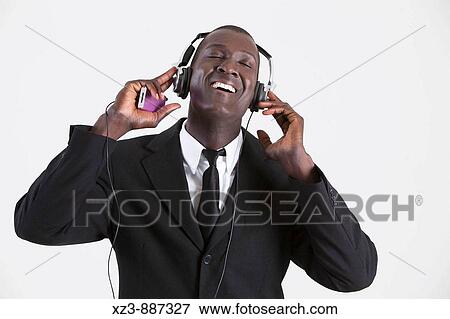 Portrait of a young black man listening to music View Large Photo Image Stock Photo - Portrait of a young black man listening to music. Fotosearch