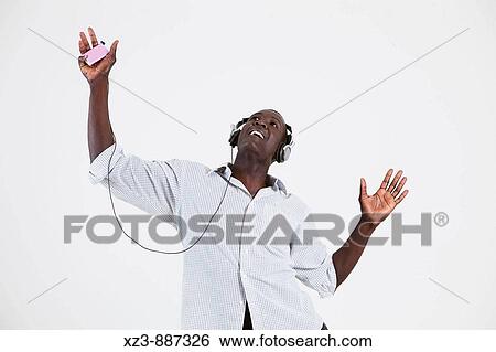 Portrait of a young black man listening to music View Large Photo Image Stock Photograph - Portrait of a young black man listening to music. Fotosearch