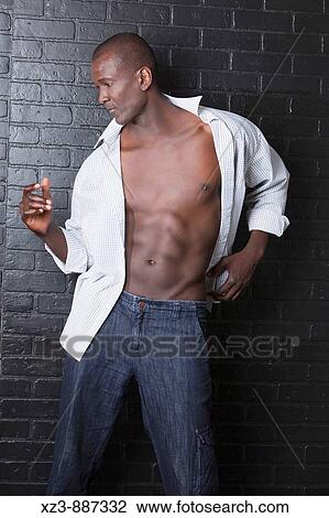Portrait of a young black man View Large Photo Image Stock Image - Portrait of a young black man. Fotosearch