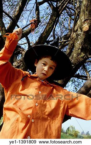 Portrait of a young boy dressed like a wizard for Halloween, France View Large Photo Image Stock Photo - Portrait of a young boy dressed like a wizard for Halloween, France. Fotosearch
