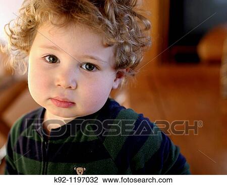 Portrait of a young boy View Large Photo Image Stock Image - Portrait of a young boy. Fotosearch
