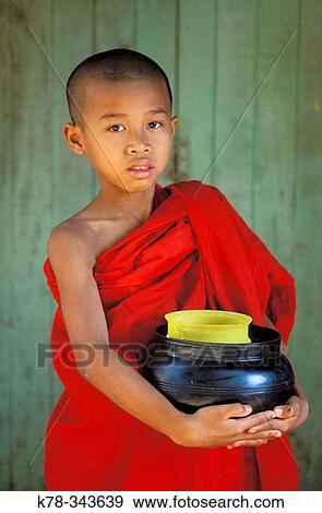 Stock Photo - Portrait of a young Buddhist Monk. Mandalay, Myanmar. Fotosearch