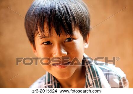 Portrait of a young Cambodian boy in a village outside of Phnom Penh, Cambodia. View Large Photo Image Picture - Portrait of a young Cambodian boy in a village outside of Phnom Penh, Cambodia.. Fotosearch