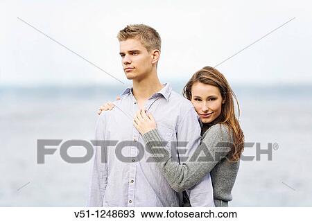 Portrait of a young couple by the sea View Large Photo Image Stock Image - Portrait of a young couple by the sea. Fotosearch