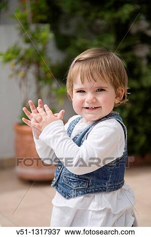 Stock Photo - Portrait of a young girl in patio. Fotosearch