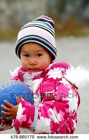 Stock Photo - Portrait of a young girl in the small village of Itilleq, Greenland. Fotosearch