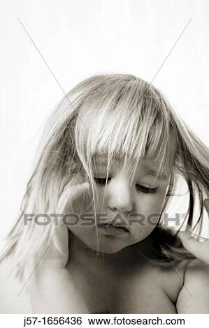 Portrait of a young girl with pediatric cancer leukaemia looking down and somber, feeling pain View Large Photo Image Stock Photograph - Portrait of a young girl with pediatric cancer leukaemia looking down and somber, feeling pain. Fotosearch