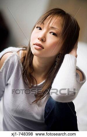 Portrait of a young Japanese woman View Large Photo Image Stock Photo - Portrait of a young Japanese woman. Fotosearch
