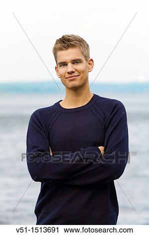 Portrait of a young man by the sea View Large Photo Image Stock Image - Portrait of a young man by the sea. Fotosearch