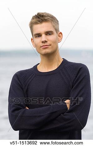 Portrait of a young man by the sea View Large Photo Image Stock Image - Portrait of a young man by the sea. Fotosearch