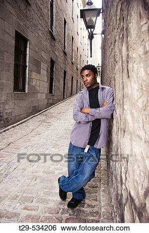 Portrait of a young man in Montreal. Quebec. Canada. View Large Photo Image Stock Photograph - Portrait of a young man in Montreal. Quebec. Canada.. Fotosearch