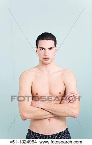 Picture - Portrait of a young man in the bathroom. Fotosearch
