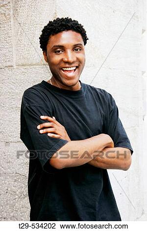 Stock Image - Portrait of a young man laughing. Fotosearch