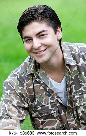 Portrait of a young man outdoors View Large Photo Image Stock Image - Portrait of a young man outdoors. Fotosearch