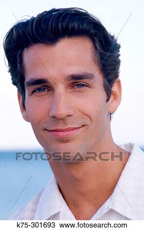 Portrait of a young man outdoors View Large Photo Image Stock Image - Portrait of a young man outdoors. Fotosearch