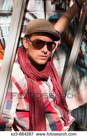 Stock Photo - Portrait of a young man outdoors.. Fotosearch