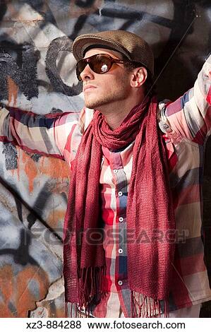 Stock Photo - Portrait of a young man outdoors.. Fotosearch